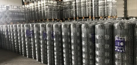 Multiple rolls of wire mesh prepared for fence material planning