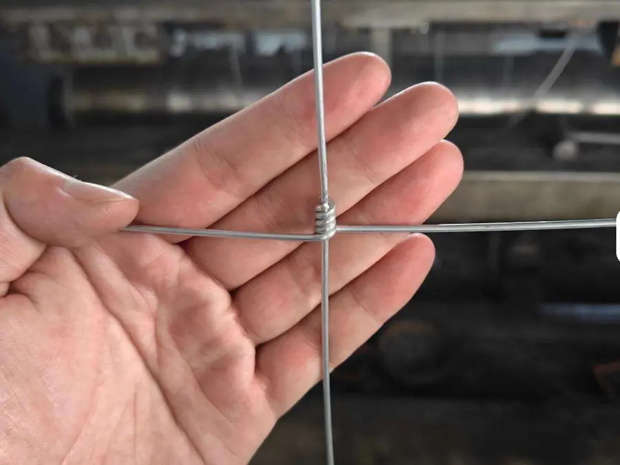 Close view of a hinge-joint connection wrapping the line wire