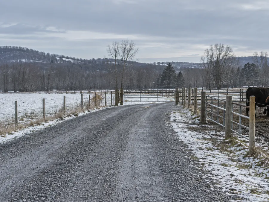 Representative winter service lane illustrating feed-delivery and maintenance access
